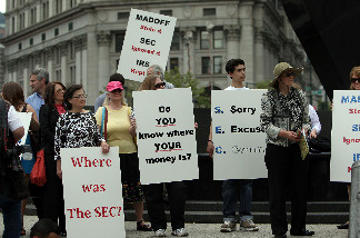 Bernard Madoff fraud victims hold a news conference and protest following the sentencing hearing for Madofff, who was convicted for running a multibillion-dollar ponzi scheme, at Federal District Court in Manhattan on June 2009 in New York City.