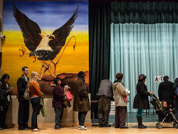 People wait in line to vote at the Columbia Heights Educational Campus on Nov. 6 in Washington, D.C.