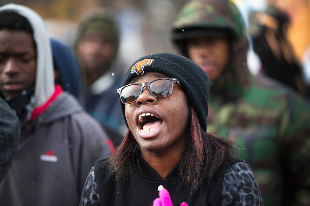 Tense Ferguson, Missouri Awaits Grand Jury Findings In Shooting Of Michael Brown FERGUSON, MO - NOVEMBER 16: Demonstrators mark with a protest the 101st day since 18-year-old Michael Brown was killed on November 17, 2014 in Clayton, Missouri. Brown was killed by Darren Wilson, a Ferguson police officer, on August 9. A grand jury in Clayton is sorting through evidence from the shooting to decide if Wilson should be charged in the shooting. The decision is expected sometime this month. (Photo by Scott Olson/Getty Images)