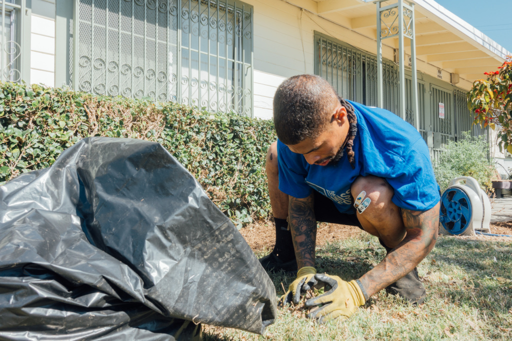 The Mission Continues landscaping Watts Volunteers with The Mission Continues helped spruce up the landscaping at Gonzaque Village in Watts.