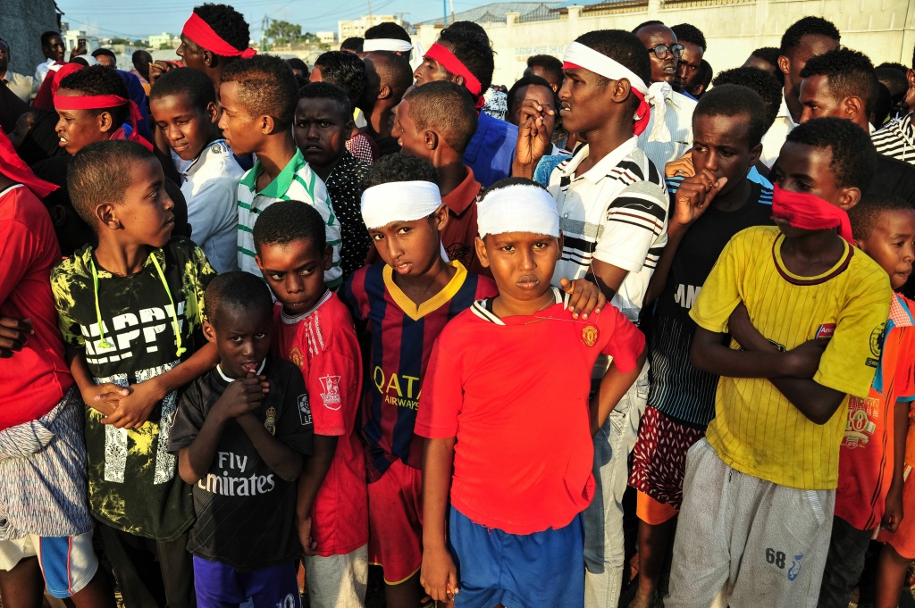 SOMALIA-BOMBING-CONFLICT-PROTEST People wear headbands as a sign of anger as they protest after a truck bomb exploded outside of the Safari Hotel in Mogadishu on October 15, 2017.