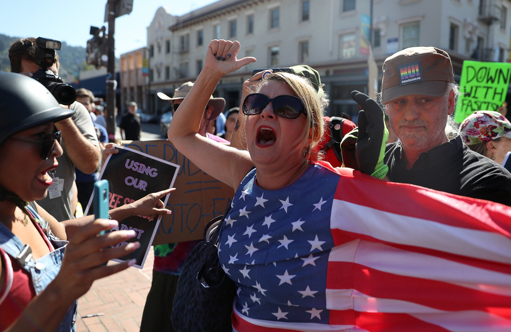 Right Wing Commentator Milo Yiannopoulos Gives Speech At Plaza In Berkeley BERKELEY, CA - SEPTEMBER 24: Protesters shout at each other during a free speech rally with right wing commentator Milo Yiannopoulos at U.C. Berkeley on September 24, 2017 in Berkeley, California. Hundreds of protesters came out to support and demonstrate against Milo Yiannopoulos as he held a free speech rally at U.C. Berkeley. (Photo by Justin Sullivan/Getty Images)