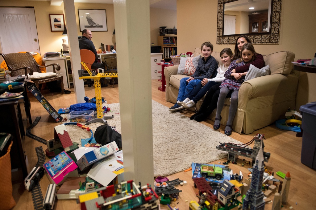 DOUNIAMAG-US-WOMEN-ECONOMY-EMPLOYMENT-LABOR Tess Finnegan poses with her family on December 12, 2017, in Washington, DC. The U.S. economy is nearing full employment but women in the workforce don't fully benefit, often due to the lack of widely available and affordable child care and preschool programs.