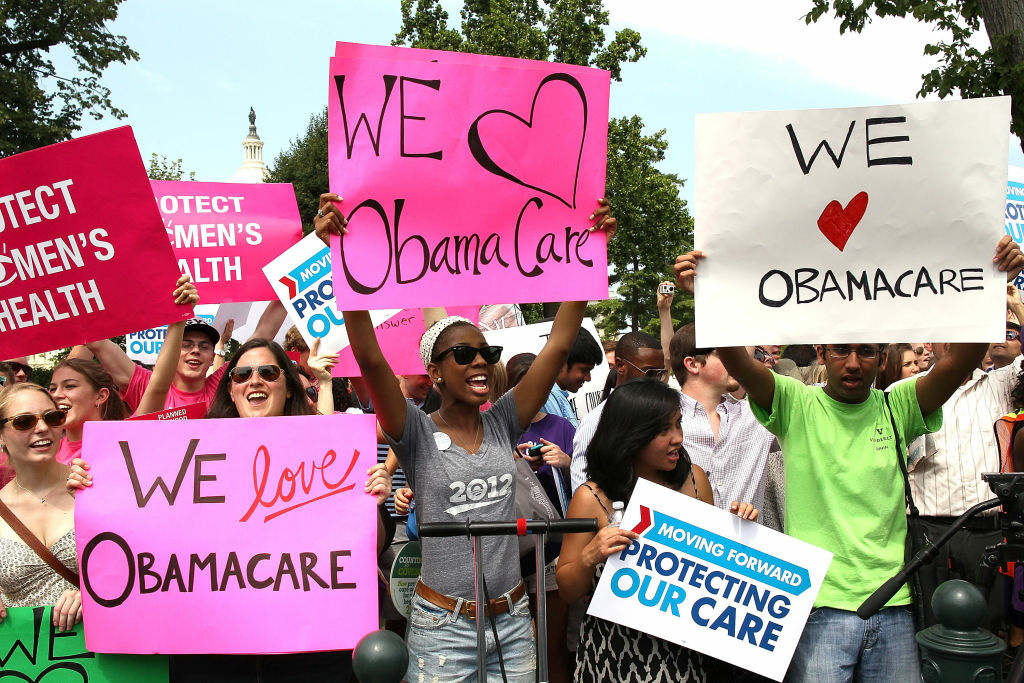 Supreme Court Upholds Obama's Affordable Care Act WASHINGTON, DC - JUNE 28: Obamacare supporters react to the U.S. Supreme Court decision to uphold President Obama's health care law, on June 28, 2012 in Washington, DC. Today the high court upheld the whole healthcare law of the Obama Administration. (Photo by Mark Wilson/Getty Images)
