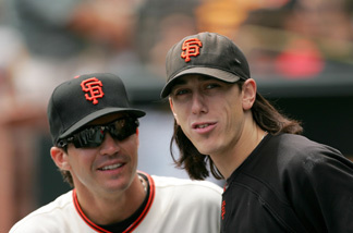 Tim Lincecum #55 and Barry Zito (R) #75 of the San Francisco Giants stands in the dugout before their game against the Colorado Rockies at AT&T Park on August 30, 2009 in San Francisco, California.