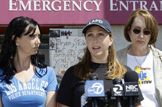 Erin Collins, center, sister, Bonnie Stow, left, sister, and Ann Stow, right, mother of San Francisco Giants fan Bryan Stow, express thanks during a news conference at a hospital in San Francisco, Monday, May 23, 2011. Bryan Stow, 42, was severely beaten outside Dodger Stadium in Los Angeles on March 31, 2011. A tip from a parole officer late last week led to the arrest Sunday of Giovanni Ramirez, 31, of Los Angeles in the attack.