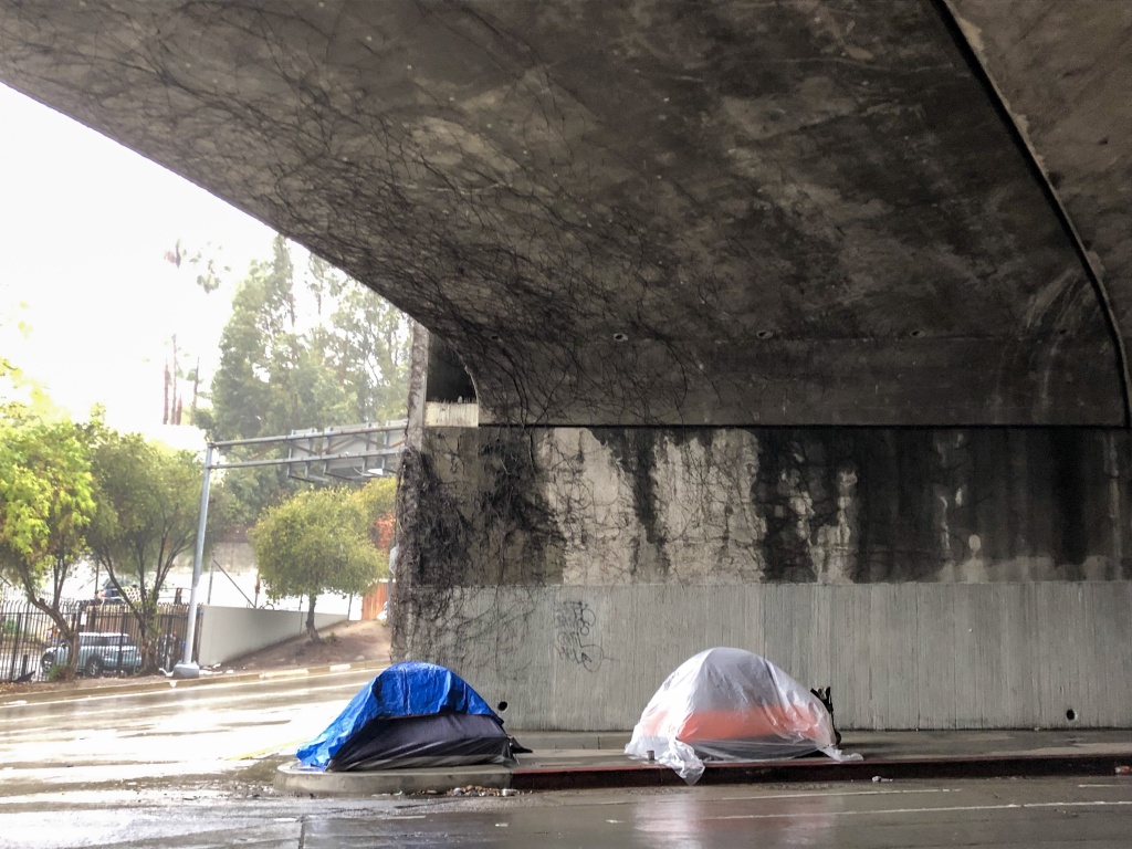 Two tents in Hollywood erected beneath the 101 Freeway during a January rainstorm. (Matt Tinoco/KPCC) Two tents in Hollywood erected beneath the 101 Freeway during a January rainstorm. (Matt Tinoco/KPCC)