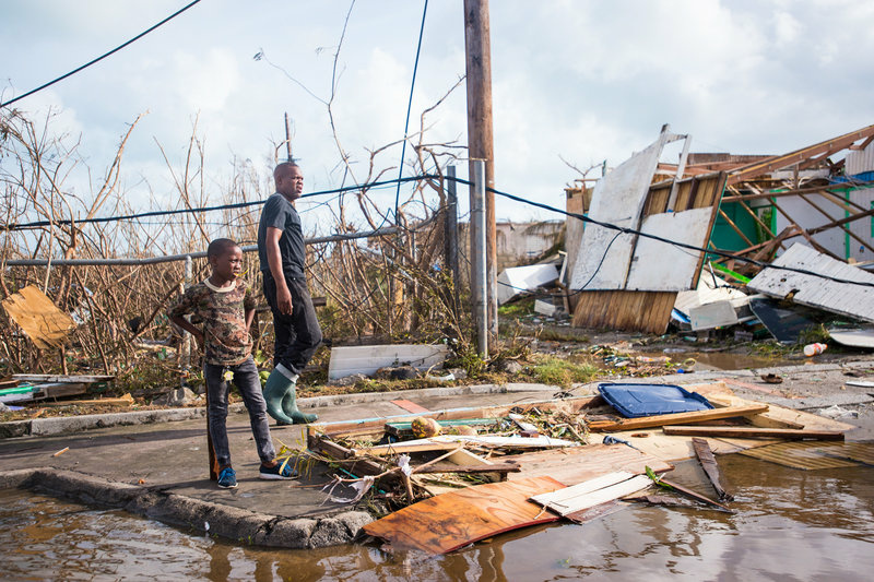 gettyimages-843749720_slide-60a915d3f45b751d339deddfd06d391ed2f193fb-s800-c85.jpg People take in the damage from Hurricane Irma in Marigot on the island of St. Martin on Thursday.