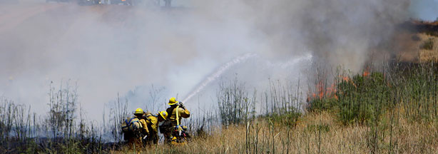 File photo: Firefighters from the Los Angeles Fire Department extinguish a fire during Camp Pendleton’s 30th annual Fire School training exercise, June 9, 2010.