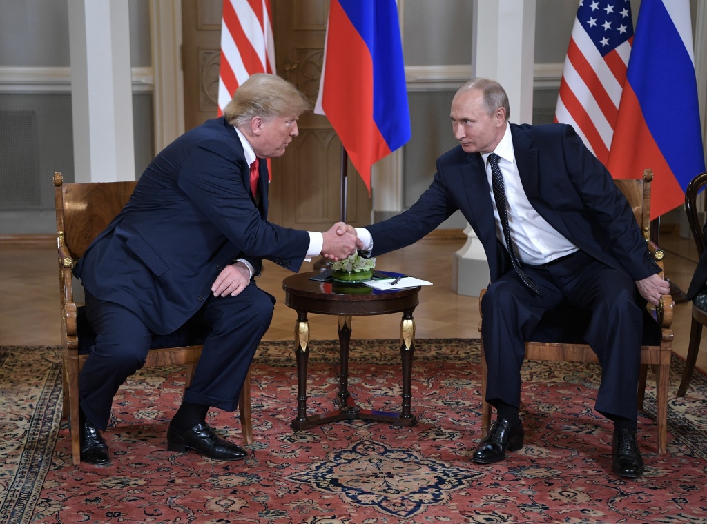 US President Donald Trump shakes hands with Russia's President Vladimir Putin (R) during a meeting in Helsinki, on July 16, 2018. US President Donald Trump shakes hands with Russia's President Vladimir Putin.