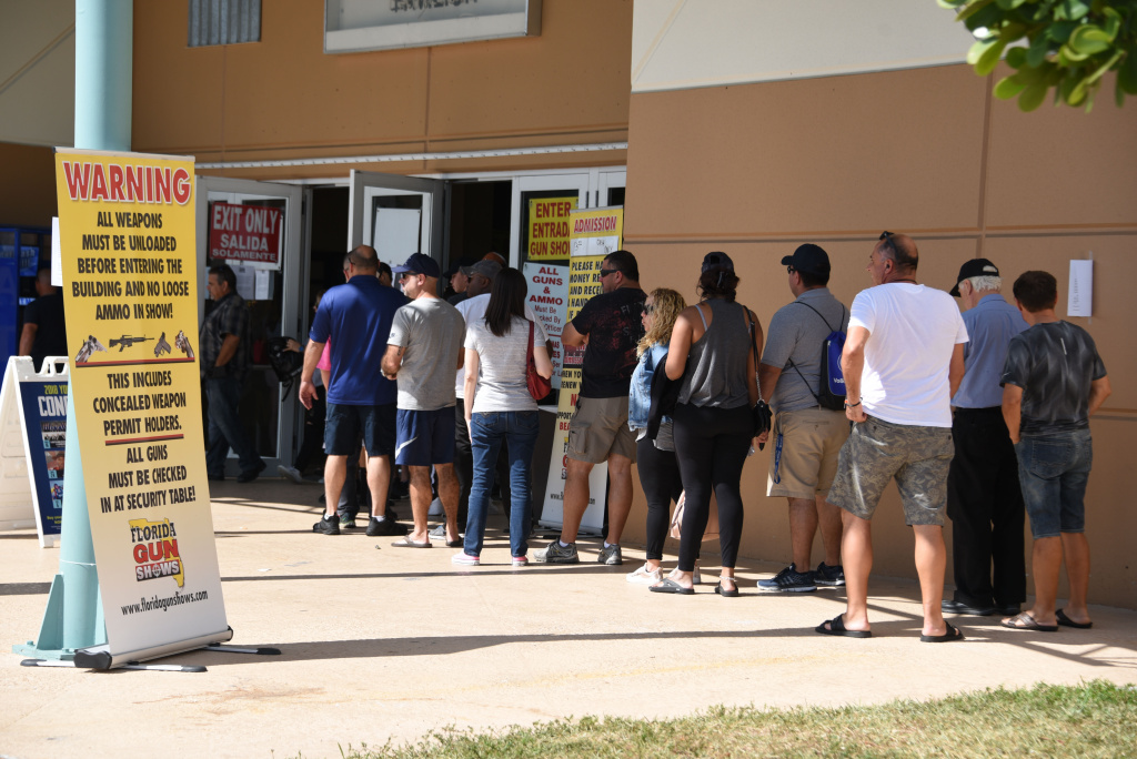 US-SOCIETY-CULTURE-GUNS Gun enthusiasts attend the South Florida Gun Show at Dade County Youth Fairgrounds in Miami, Florida, on February 17, 2018, three days after a mass shooting 30 miles away at the Marjory Douglas High School in Parkland, Florida.