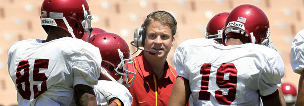 Head coach Lane Kiffin gives instructions in the offensive huddle during the USC Trojans spring game on May 1, 2010 at the Los Angeles Memorial Coliseum in Los Angeles, California.