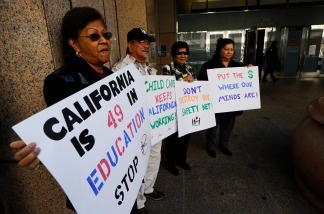 Mercer 15992 Protestors take part in a rally with several union and community activist groups representing the disabled in front of Gov. Jerry Brown's office on January 10, 2011 in Los Angeles, California.