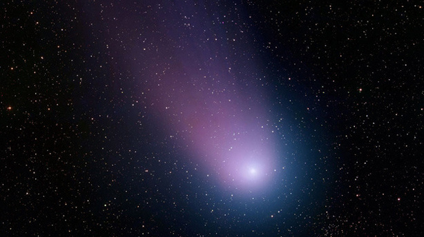 In 2004, Comet C/2001 Q4 (NEAT), seen here, passed within 30 million miles of the Earth's orbit. A new report suggests that such near-Earth objects may go undetected by NASA, unless additional funding is provided.