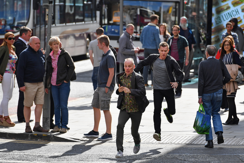 Filming Begins On Trainspotting 2 Actors Ewan McGregor and Ewan Bremner run on the set of the Trainspotting film sequel on Princess Street on July 13, 2016 in Edinburgh, Scotland.