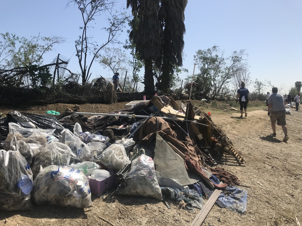 Piles and piles of garbage were collected from an abandoned homeless camp on the riverbank. Photo credit: Audrey Alden Piles and piles of garbage were collected from an abandoned homeless camp on the riverbank. Photo credit: Audrey Alden