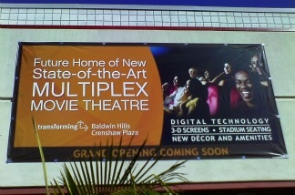 Banners at the Baldwin Hills Crenshaw Plaza promise a new, state-of-the-art cinema multiplex to replace the Magic Johnson Theatres, which closed over the summer.