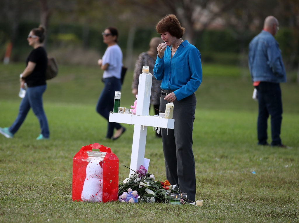 Florida Town Of Parkland In Mourning, After Shooting At Marjory Stoneman Douglas High School Kills 17 Florida gubernatorial candidate Gwen Graham visits a temporary memorial at Pine Trails Park on February 17, 2018 in Parkland, Florida.