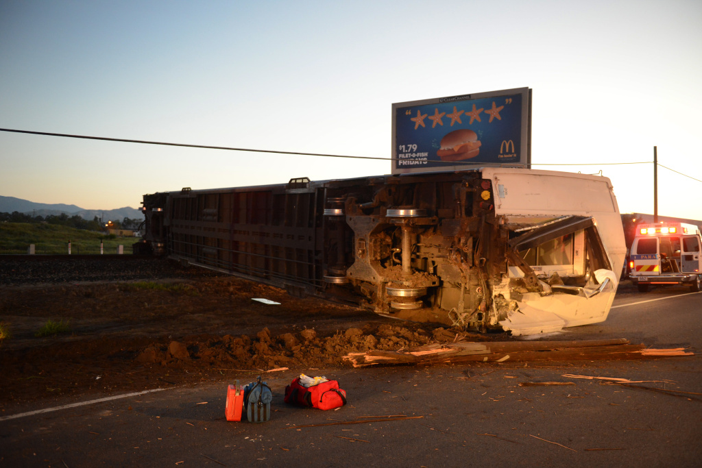 Train-Truck Crash An overturned Metrolink passenger car rests on the side of the road after the train crashed into a truck and derailed early on Tuesday, Feb. 24, 2015 in Oxnard, Calif. Three cars of a Southern California Metrolink commuter train derailed and tumbled onto their sides after a collision with a truck on tracks in Ventura County northwest of Los Angeles.