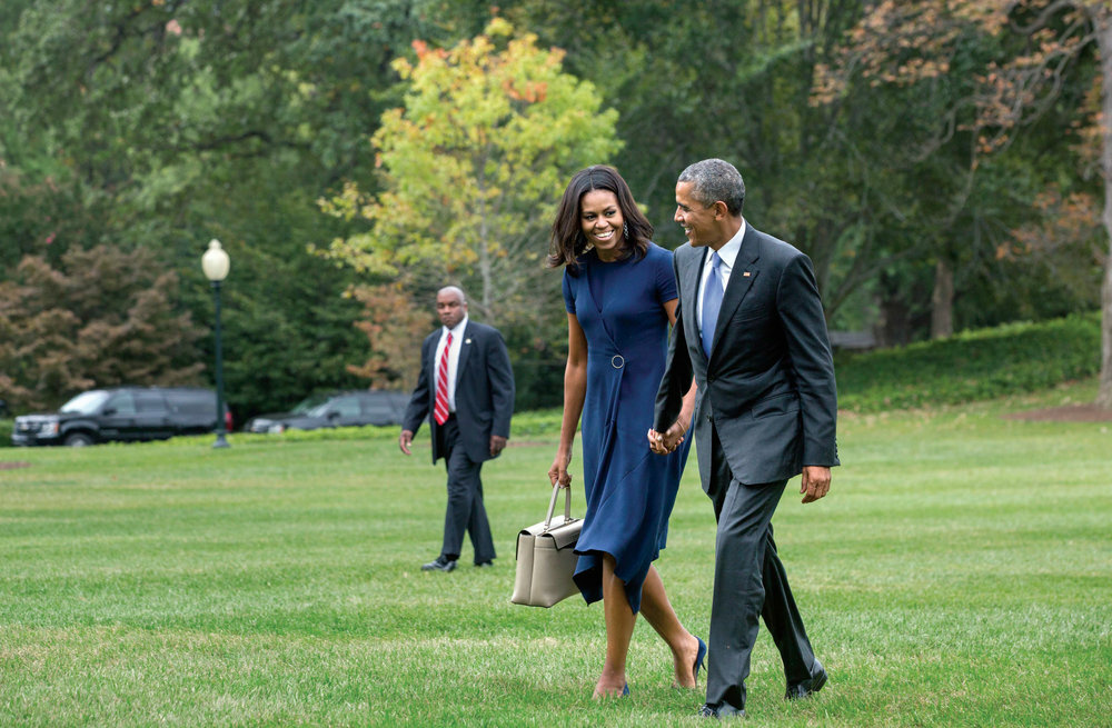 Michelle Obama President Barack Obama and First Lady Michelle Obama walk from Marine One on the White House South Lawn, September 29, 2015.