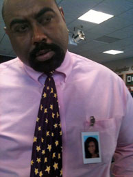Mitrice Richardson's father Michael Richardson at a press conference on Aug. 12, 2010. He wears his daughter's photo on his chest.