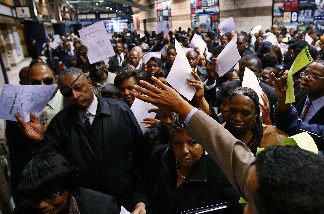 Job applicants line up for interviews during a jobs fair at Nationals Park co-hosted by the AARP May 11, 2010 in Washington, DC.