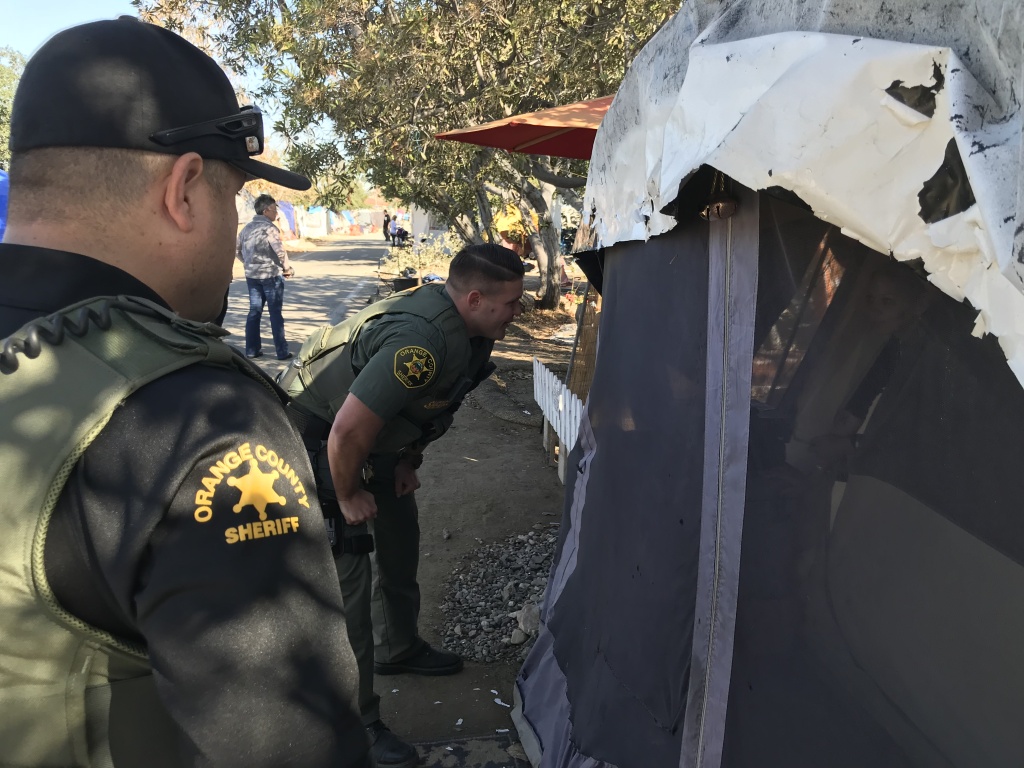 OC homeless encampments Orange County sheriff's deputies on Monday began going tent to tent along the Santa Ana River telling people the area will be closed and they need to move.