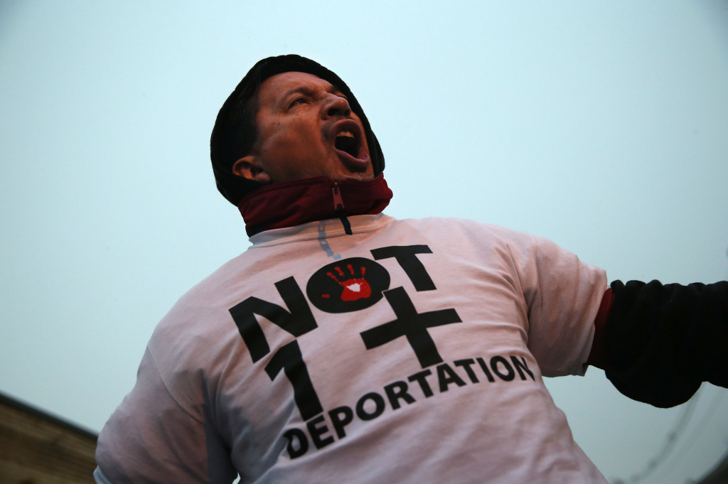 Immigrant Rights Advocates Protest At Elizabeth Detention Center A protester is arrested by police after blocking the entrance of an immigrant detention center on December 10, 2013 in Elizabeth, New Jersey.