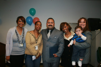 (L to R) Caseworkers Karen Gage and Yvonne Holman, Ernest Melendrez, caseworker Kendra Tankersley and Ernest's fiancee Launi Perry and their 9-month-old son at the Family Reunification Week celebrations organized by Los Angeles County Department of Children and Family Service, in their Vermont Corridor office on March 2, 2010.