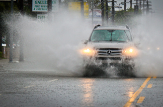 A Mercedes Benz SUV drives through heavy rains Sunday, March 20, 2011 in the San Fernando Valley.