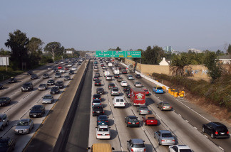 Drivers on the 110 Freeway south of downtown Los Angeles can exercise a new option - toll lanes for carpools and solo drivers with transponders. L.A. County Metro has begun a one-year experiment that ends a 70-year tradition of "free" freeway travel in the county.