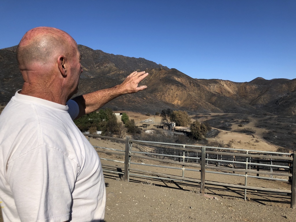 Butch Humphrey Woolsey Butch Humphrey explains how the fire came over the ridge and toward his house.