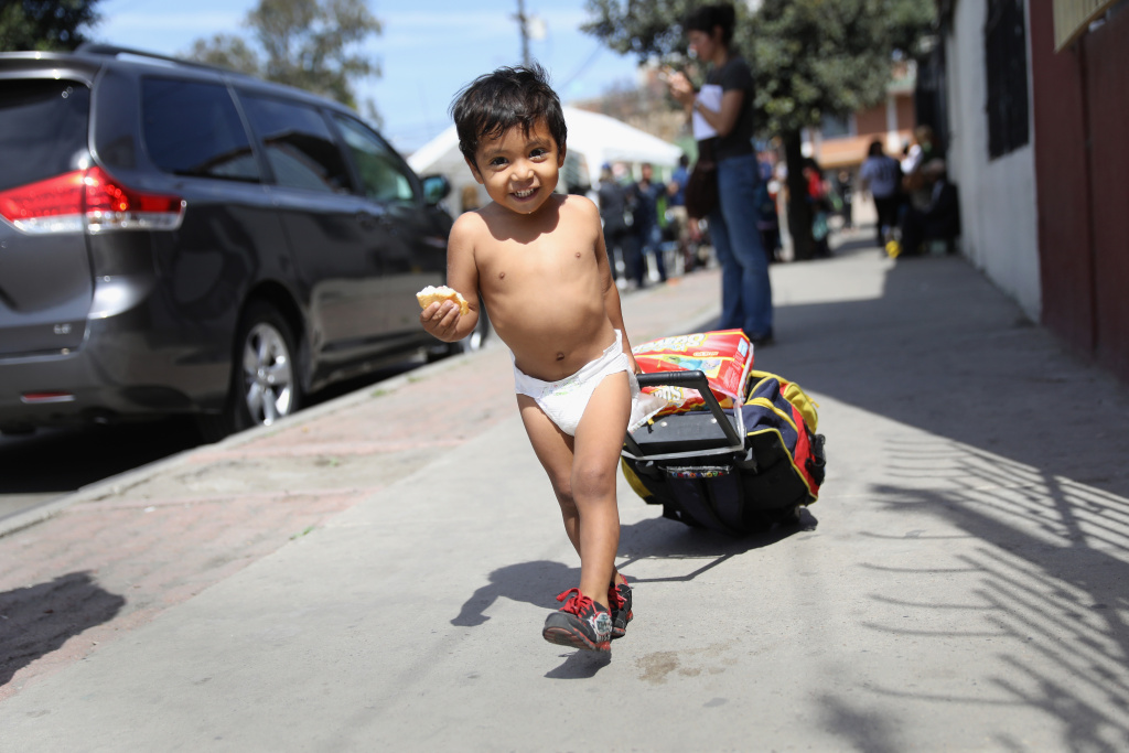Migrant Caravan Traveling Through Mexico Nears U.S. Honduran asylum seeker Daniel Once, 2, arrives at a shelter with his family on April 25, 2018 in Tijuana, Mexico. More than 300 immigrants, the remnants of a caravan of Central Americans that began almost a month ago, were arriving in Tijuana on the last leg of their journey north.