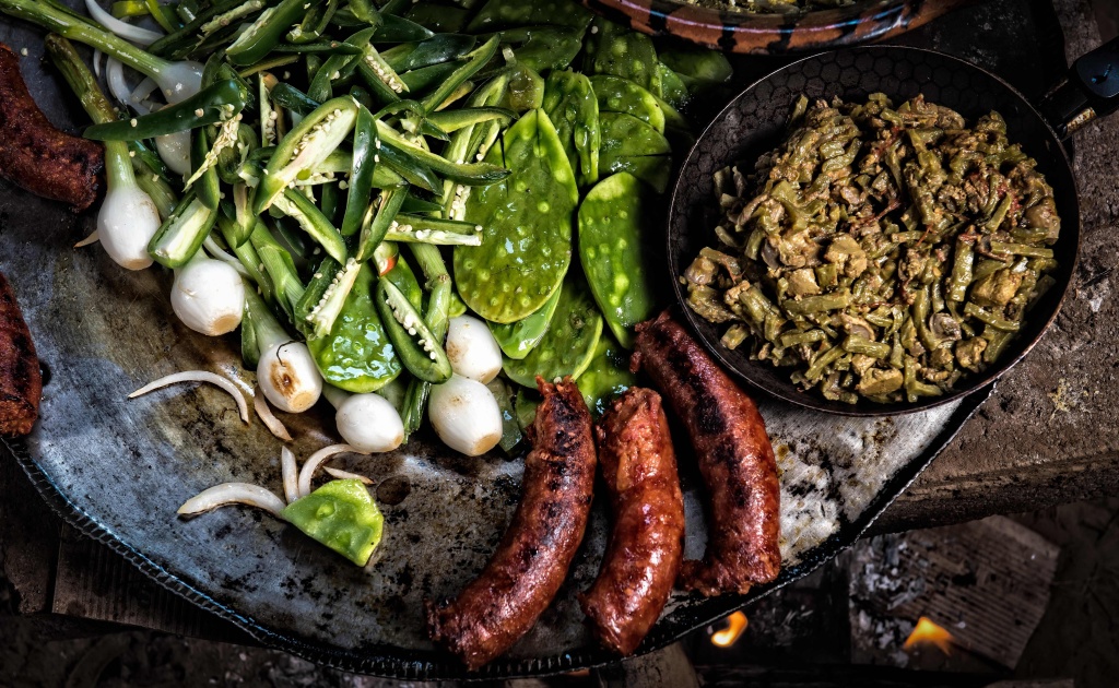 MEXICO-GASTRONOMY-NOPAL-PRICKLY-PEAR A breakfast of prickly pear or nopal cactus fried with chicken gizzards is served with cambray onions and pork sausage on a comal in the Mexico City borough of Milpa Alta, on April 11, 2017.