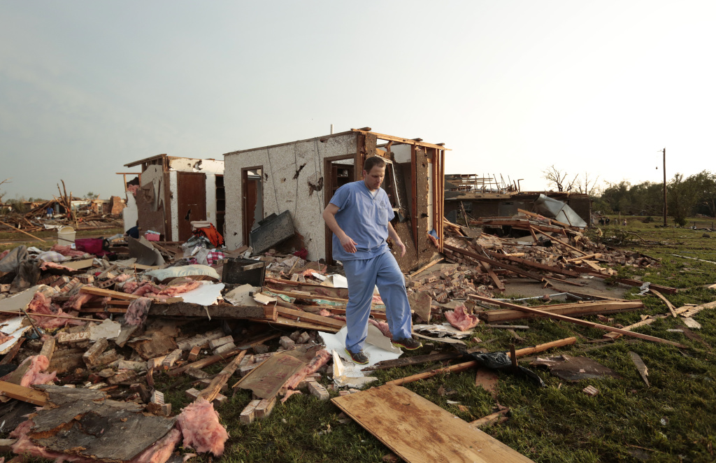 Tornado Outbreak Slams Through Oklahoma Nathan Ulepich searches outside the back of his house destroyed after a powerful tornado ripped through the area on May 20, 2013 in Moore, Oklahoma. The tornado, reported to be at least EF4 strength and two miles wide, touched down in the Oklahoma City area on Monday killing at least 51 people.
