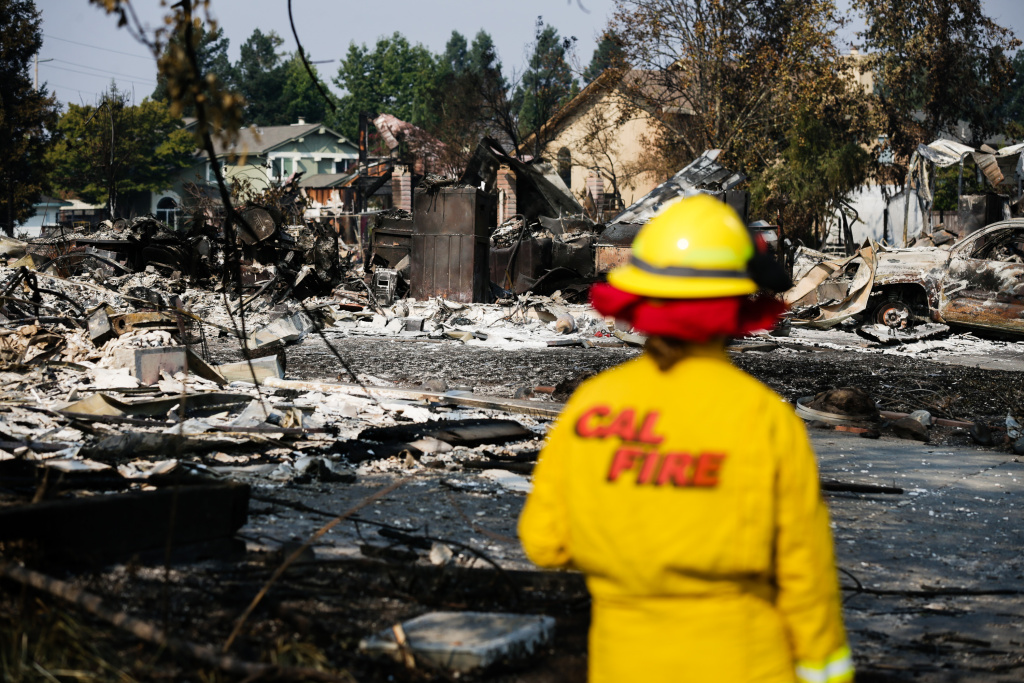 Multiple Wildfires Continue To Ravage California Wine Country A Cal Fire employee surveys damage caused by the Tubbs Fire in the Coffey Park neighborhood of Santa Rosa, California on October 13, 2017.