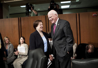 U.S. Supreme Court nominee Elena Kagan speaks with committee chairman Senator Patrick Leahy (D-VT) while she leaves after testifying before the Senate Judiciary Committee on the third day of her confirmation hearings on Capitol Hill June 30, 2010 in Washington, DC.