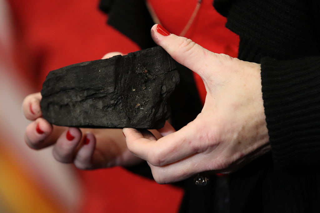 House Dem Leader Pelosi And The Democratic Women's Working Group Urge GOP To Drop Children's Health Insurance Program Rep. Kathy Castor (D-FL) holds up a symbolic piece of coal for the holiday season during a press conference on December 20, 2017 in Washington, DC.