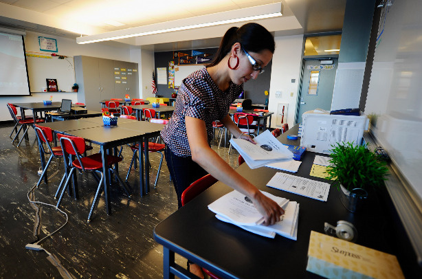 Monique Cruz Garcia, sixth grade english history teacher, prepares her class room at the newly opened Robert F. Kennedy Community Schools complex on September 13, 2010 in Los Angeles, California.
