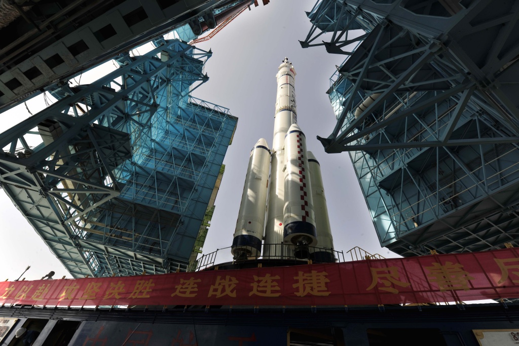 CHINA-SPACE-SHENZHOU X The Shenzhou X spacecraft carried by a Long March-2F carrier rocket is installed at the launch pad in Jiuquan, Northwest China's Gansu province in the morning of June 3, 2013. The spacecraft will carry three astronauts to visit the Tiangong-1 space module, state media reported.