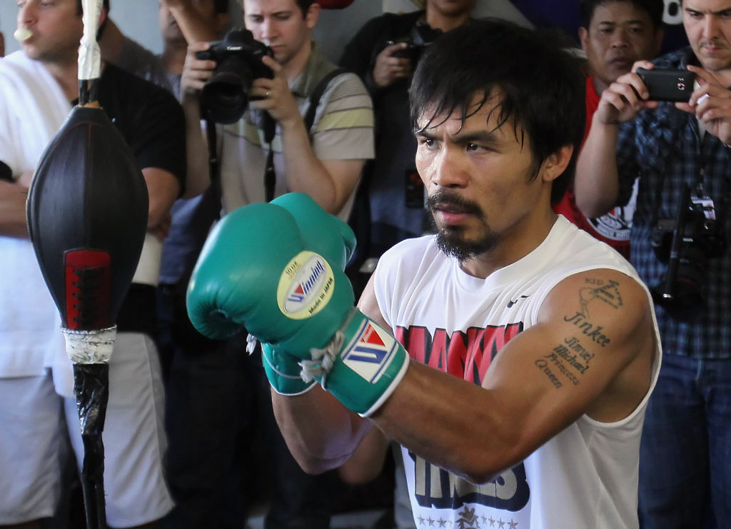 Manny Pacquiao Media Day Workout HOLLYWOOD, CA - APRIL 20: Manny Pacquiao of the Philippines trains on the speed bag during a media workout at the Wild Card Boxing Club on April 20, 2011 in Hollywood, California. (Photo by Jeff Gross/Getty Images) *** Local Caption *** Manny Pacquiao;