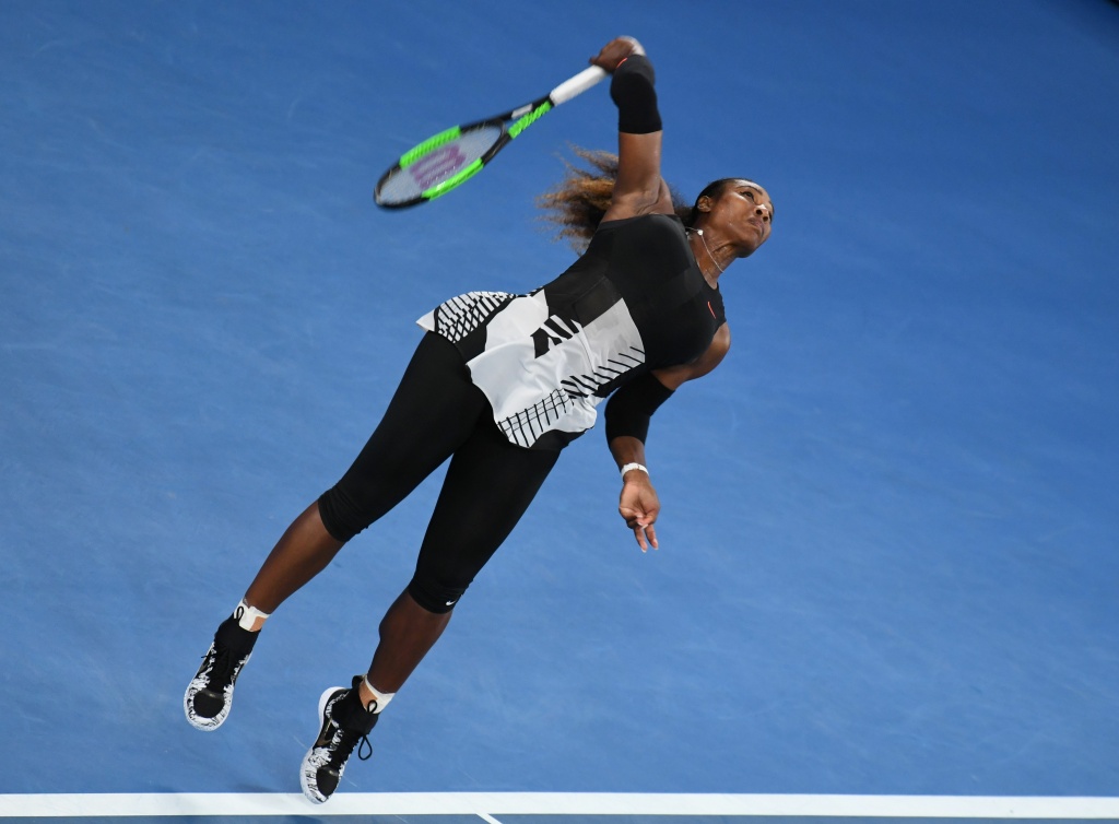 TENNIS-AUS-OPEN Serena Williams of the US serves against Venus Williams of the US during the women's singles final on day 13 of the Australian Open tennis tournament in Melbourne on January 28, 2017.