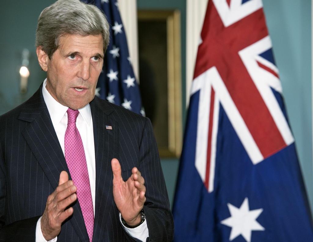US Secretary of State John Kerry speaks on Iraq during a photo opportunity with Australian Prime Minister Tony Abbott shortly before the two had a private meeting on June 12, 2014 at the US Department of State in Washington, DC. Kerry said Monday that Washington is "open to discussions" with Tehran if the Iranians can help end the violence and restore confidence in the Iraqi government.