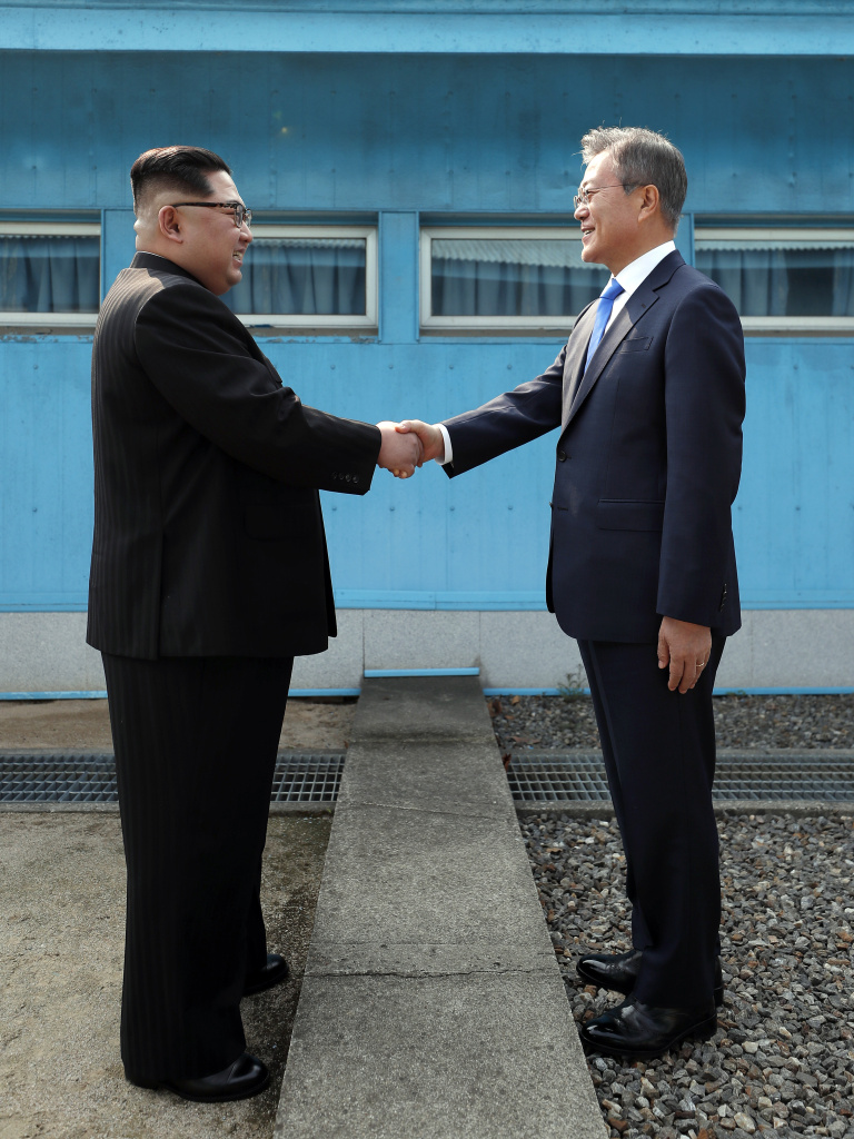 Inter-Korean Summit 2018 North Korean Leader Kim Jong Un, left, and South Korean President Moon Jae-in shake hands over the military demarcation line upon meeting for the Inter-Korean Summit on April 27, 2018 in Panmunjom, South Korea.