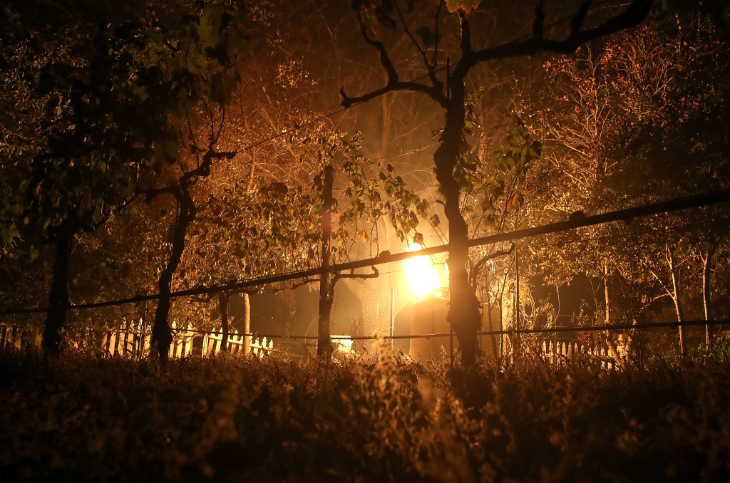 Multiple Wildfires Destroy Homes, Threaten California Wine Country A flame from an open gas line illuminates grape vines in a vineyard during the Nuns Fire on October 9, 2017 in Glen Ellen, California.
