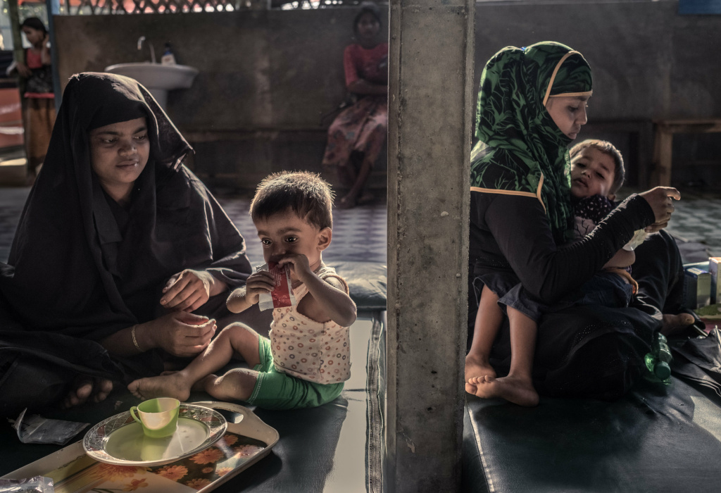 Rohingya refugees Myanmar Rohingya refugees feed their malnourished children at a feeding center in Kutupalong camp.