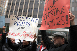 Immigrants, activists and supporters of illegal immigrants rally against a new Arizona law on April 27, 2010 outside of Federal Plaza in New York City.