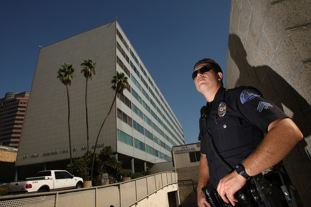 California Budget Crisis Threatens Basic Services A Los Angeles police officer stands guard outside Parker Center (L), headquarters for the Los Angeles Police Department (LAPD) on October 8, 2008 in Los Angeles, California.