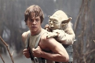 A 1980 publicity image originally released by Lucasfilm Ltd., shows Mark Hamill as Luke Skywalker and the character Yoda in this scene from 'Star Wars Episode V: The Empire Strikes Back.'