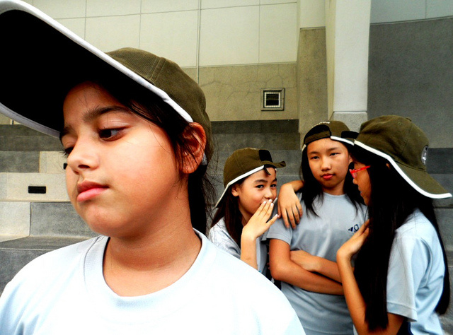 Bullying A young girl is being bullied by her classmates. A recent study found that bullying among siblings can be worse than bullying at school.